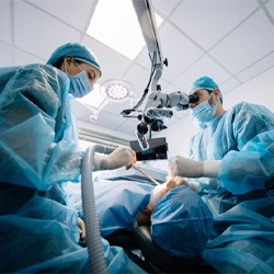 Oral surgeons placing dental implants