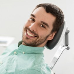 Man with dental implants at dentist’s office