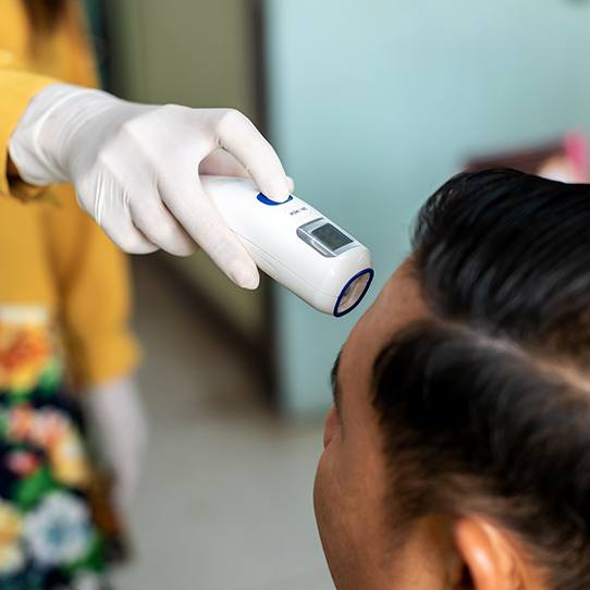 Patient receiving touchless temperature reading