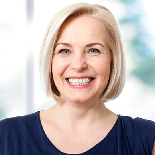 Woman with a dental bridge smiling