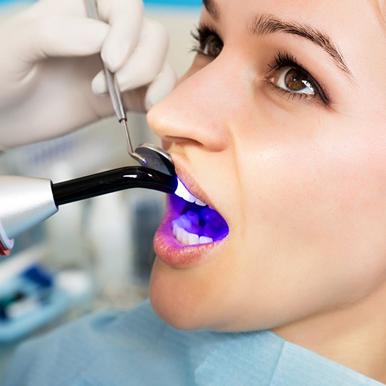 Patient receiving dental bonding treatment