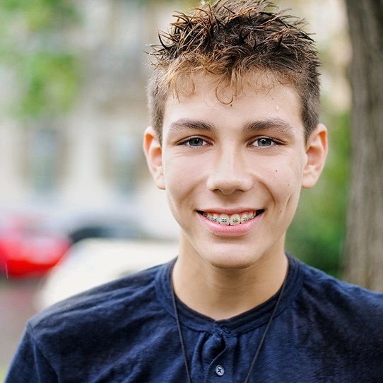 Teen boy with traditional metal braces