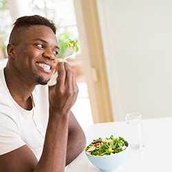 man eating a healthy diet for implants