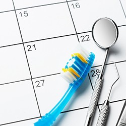 calendar and dental instruments for checkups section