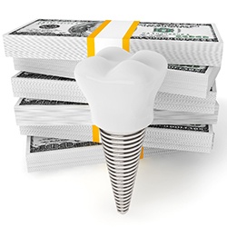 Dental implant and crown next to stack of money