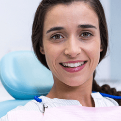 a patient smiling during her dental implant surgery appointment in Shelton