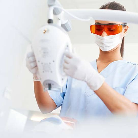 Patient receiving zoom teeth whitening treatment