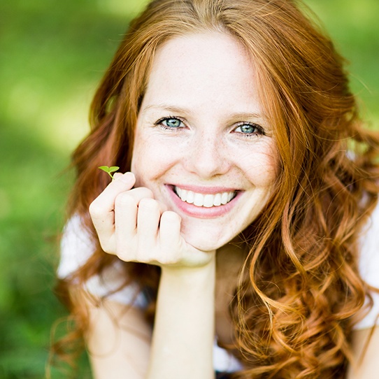 Woman with brilliant smile after teeth whitening