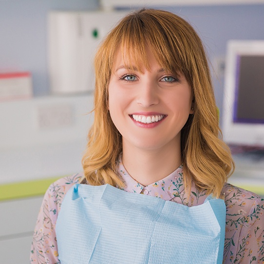 Woman smiling during zoom teeth whitening consultation
