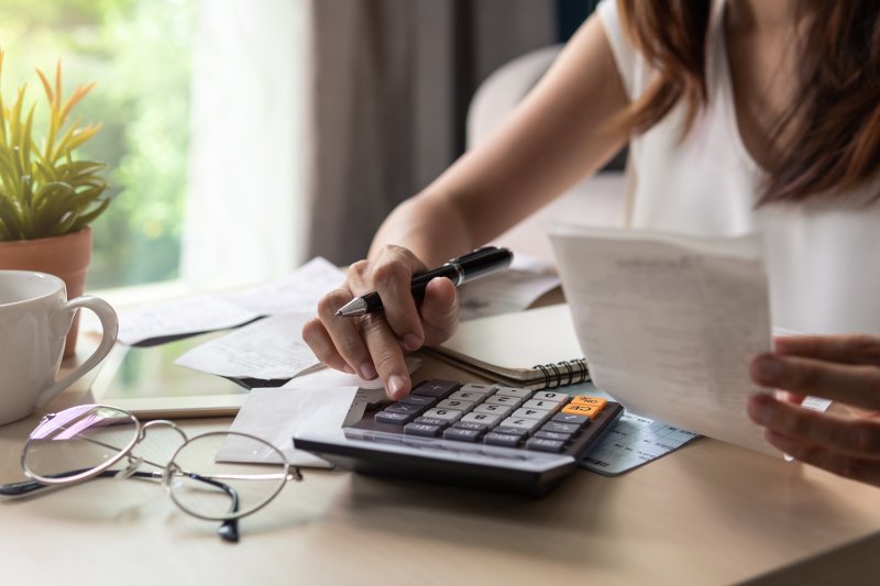 woman examining her expenses while on a budget