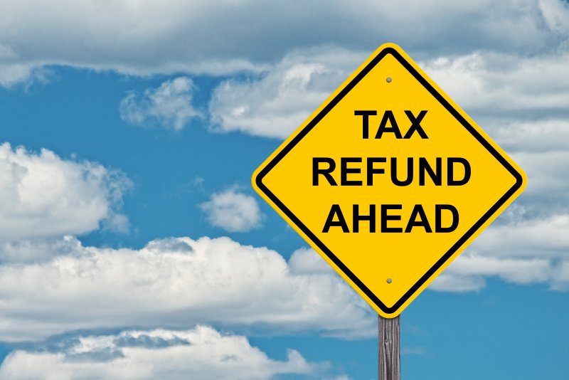 A sign displaying the words ‘Tax Refund Ahead’
